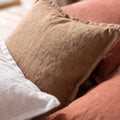 Close-up of the Coffee linen-cotton pillow cover showing its earthy brown color and textured weave